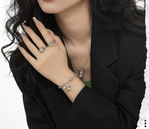 Detail of S925 sterling silver liquid metal jewelry set worn on hand and neck