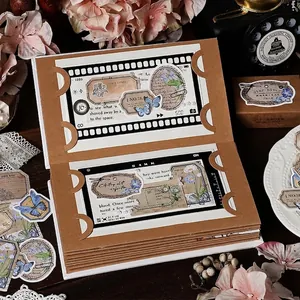 Vintage butterfly and plant accordion folder scrapbook with retro kraft paper textures