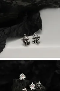 Macro detail of S925 silver ghost earrings with magic hat and vintage oxidized finish