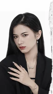 Detailed view of silver personality necklace and tassel earrings on a fashion model