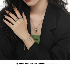Detailed view of S925 sterling silver jewelry set featuring whimsical ghost pendants