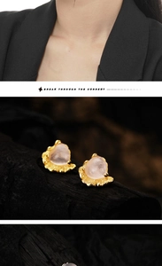 Macro shot of S925 silver heart studs with pink quartz and lava-textured gold finish