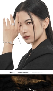 Detailed close-up of S925 silver irregular branch bracelet with translucent gemstone