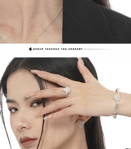 Detail of silver textured jewelry set with heart-shaped pink quartz stones on model