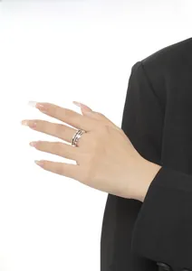 Close-up of S925 sterling silver multi-layer star ring worn with a professional outfit