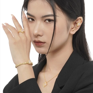 S925 silver jewelry set with gold lava texture and pink agate stones on a model