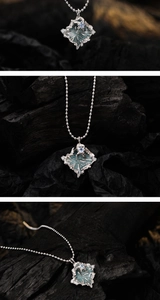 Detail of S925 silver irregular pendant with blue enamel inlay and zircon on bead chain