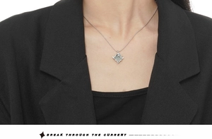 Close-up of S925 sterling silver irregular folded pendant necklace on a model