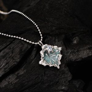 Irregular textured S925 silver necklace with blue enamel leaf and square zircon crystal