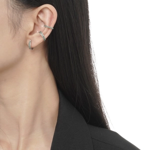 Minimalist S925 sterling silver ear cuff set with mint green stone on model's ear