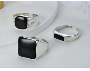 Detailed view of S925 sterling silver open rings with black enamel geometric settings