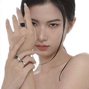 Minimalist S925 sterling silver black enamel rings set worn by a model in close-up