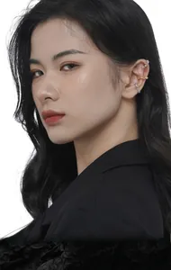 Detail of colorful zircon ear cuff set on model ear featuring S925 silver and gold finishes