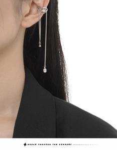 Detail of S925 silver ear bone clip with liquid lava design and hanging tassel chains