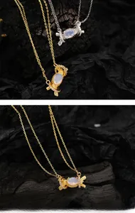 Close-up of candy-shaped S925 silver pendants with inlaid zircon and oval gemstones
