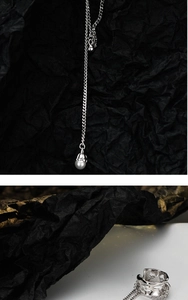 Macro detail of S925 sterling silver chain earring with elegant white pearl pendant