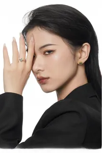 Close-up of model wearing S925 silver gemstone earrings and twisted gold ring set