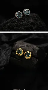 Detailed view of S925 silver gemstone studs with unique lava texture in gold and silver