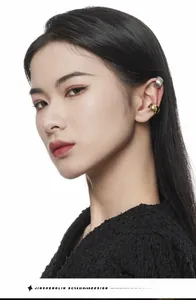 Close-up of minimalist S925 sterling silver ear cuffs in gold and brushed silver finish