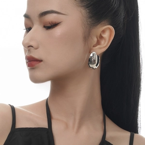 Minimalist irregular organic bean-shaped stud earrings in polished silver finish