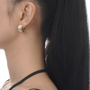 Two-tone S925 sterling silver hoop earrings with micro-set stones on model