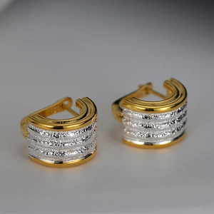 Two-tone S925 sterling silver C-shaped hoop earrings with gold trim and textured finish