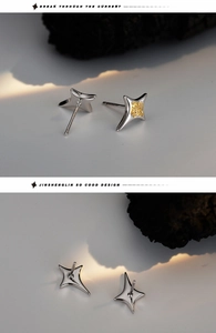 Macro detail of S925 sterling silver star stud earrings with gold textured centers