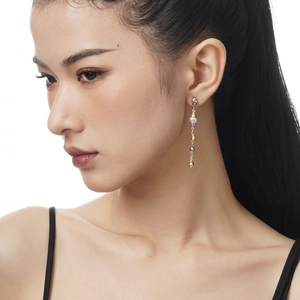 Elegant two-tone S925 silver baroque pearl tassel earrings worn by an Asian model