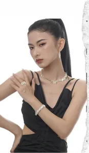 Exquisite S925 sterling silver leaf jewelry set worn by a model in a high ponytail