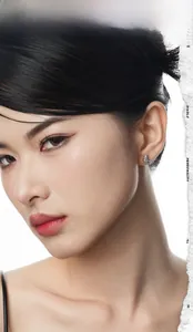 Close-up of S925 sterling silver moon stud earring with colorful pave diamonds on ear