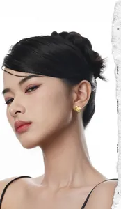 Close-up of golden S925 silver clover hoop earrings on model with matte flower petals