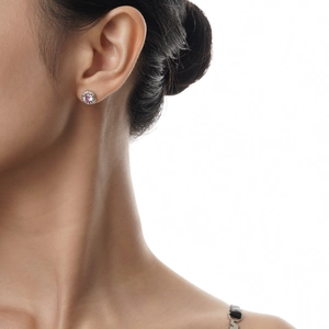 Elegant S925 sterling silver halo stud earrings with pink round zircon worn by a model