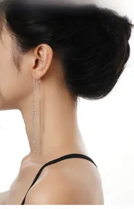Detailed view of long S925 sterling silver tassel earrings with sparkling cubic zirconia