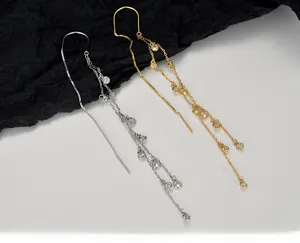 Detailed view of long S925 silver tassel earrings with sparkling crystal accents