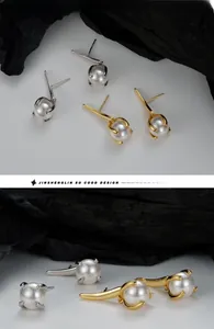 Macro view of S925 silver pearl stud earrings with leaf design and four-prong setting