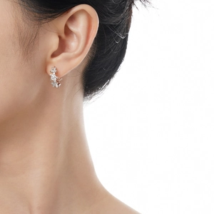 Elegant S925 sterling silver triple star earrings with sparkling zircon crystals on model