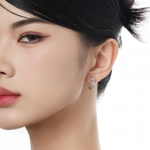 Elegant S925 sterling silver star earrings with sparkling pavé crystals on a female model