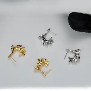 Macro view of S925 sterling silver irregular wavy earrings in gold and silver finish