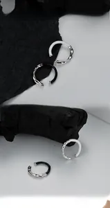 Macro detail of S925 silver liquid metal texture rings with black and white enamel glaze