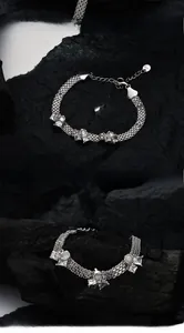 Detailed macro view of S925 sterling silver multi-layer chain bracelet with zircon stones