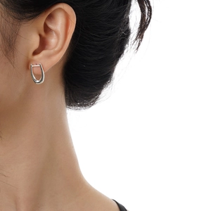 Minimalist S925 sterling silver U-shaped tassel earrings on model showing side view