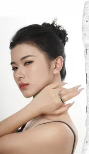 Detail of gothic S925 silver rose ring and ear cuff set with black zircon stones