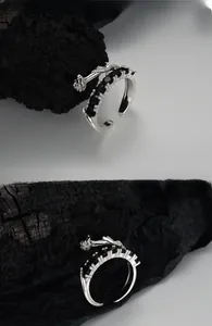 Detailed close-up of S925 sterling silver rose ring with black zircon stone row