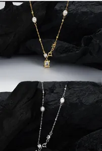 Close-up of S925 silver baroque pearl necklace with rectangular zircon pendant detail