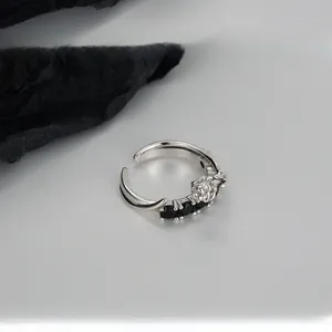 Detail of S925 sterling silver rose ring featuring three black cubic zirconia accents
