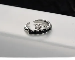 Detailed close-up of a vintage S925 sterling silver rose ring with black zircon accents