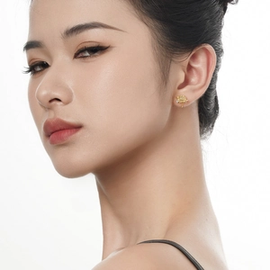 Minimalist S925 sterling silver golden Saturn stud earrings with diamonds on model