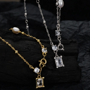 Baroque pearl S925 silver necklace with long zircon pendant on dark luxury background