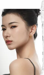 Close-up of minimalist double-layer geometric gold hoop earrings worn by a model