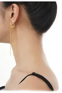 Close-up of S925 sterling silver gold fringe earrings with dangling bead chains